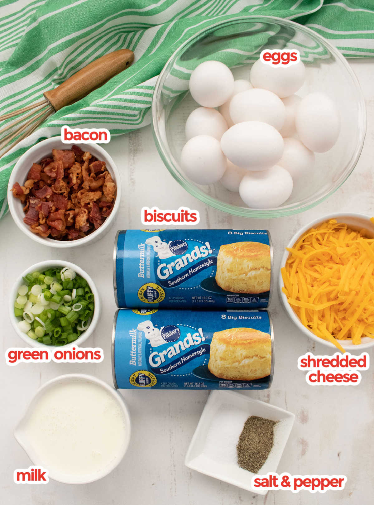 Ingredients needs to make the Breakfast casserole including biscuits, eggs, milk, cheese, green onions and bacon.