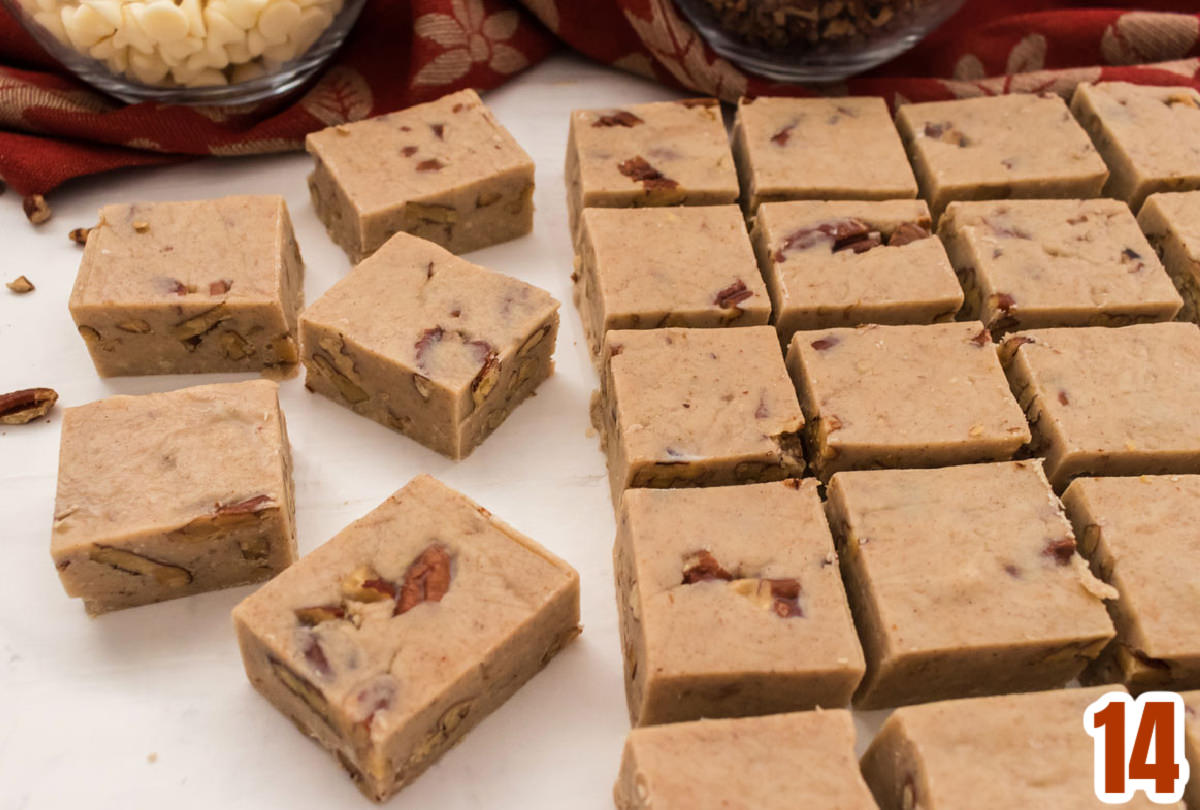 Butter Pecan Fudge laying on a white surface in rows.