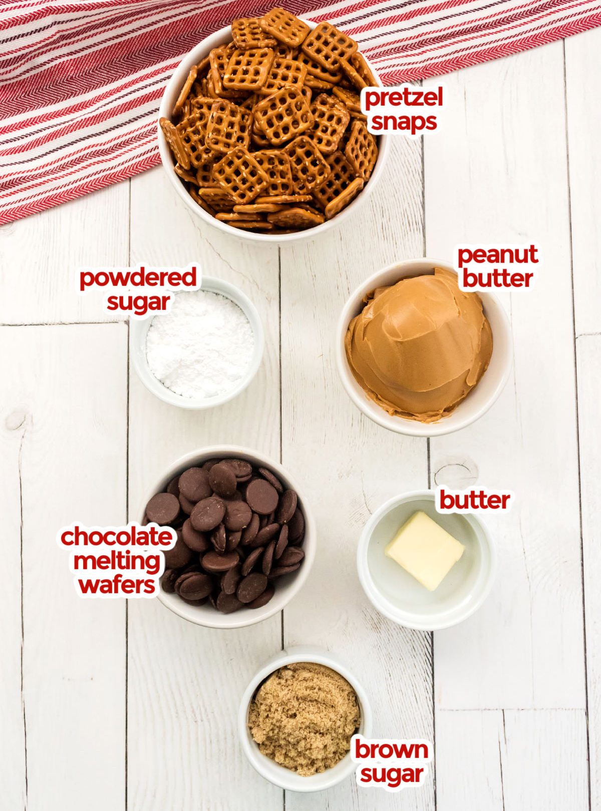 All the ingredients you will need to make Chocolate Peanut Butter Pretzel Bites including Pretzel Snaps, Powdered Sugar, Peanut Butter, Chocolate Melting Wafers, Butter and Brown Sugar.