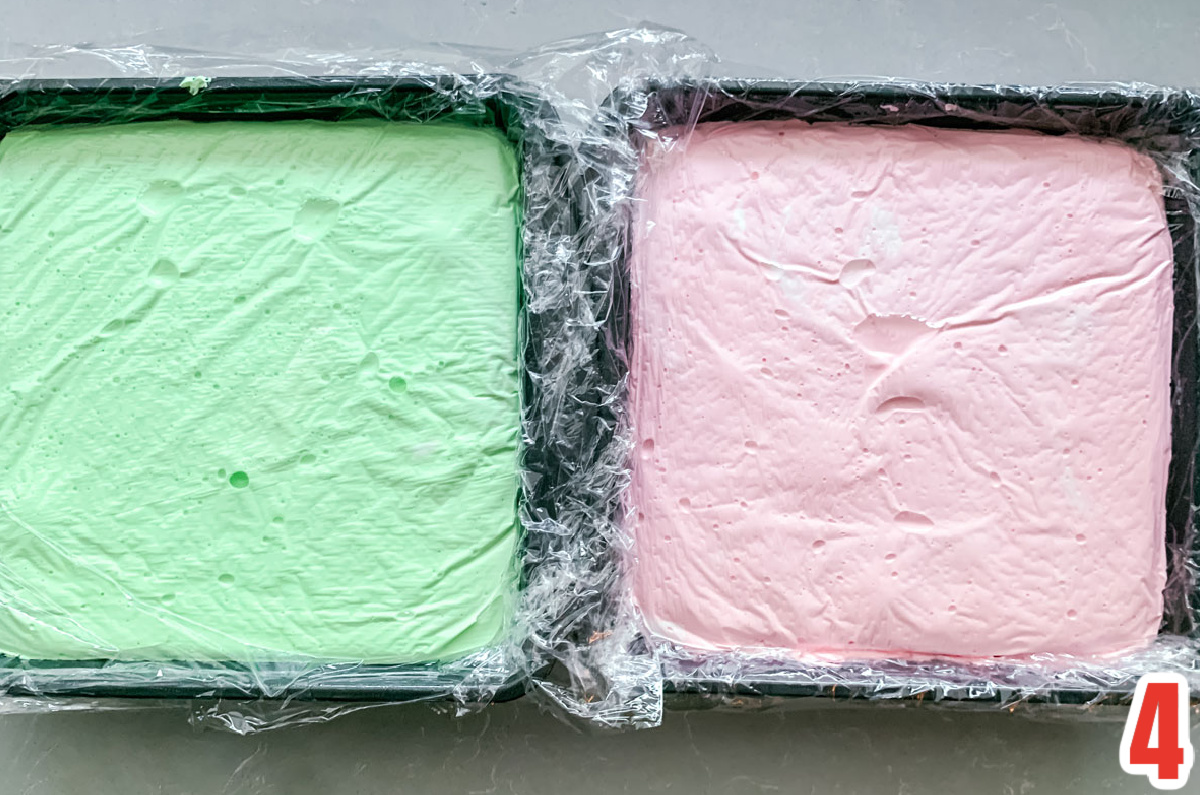 Overhead shot of two 8x8" pans filled with Green and Red Marshmallow mixture.