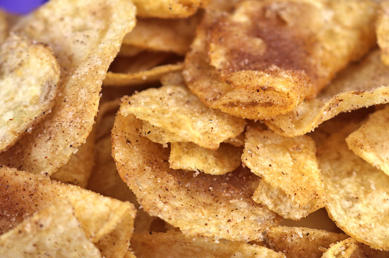 Churro Chips - turn a bag of Kettle Chips into a super easy to make sweet and salty snack that tastes just like a churro. Your family will beg you to make this yummy homemade churros treat again and again. If you love Churros you are going to love this twist on a classic made with a bag of potato chips and some cinnamon sugar. Pin this easy sweet treat for later and follow us for more family snack ideas. #Churros #HomemadeChurros #KettleChips #SweetandSalty