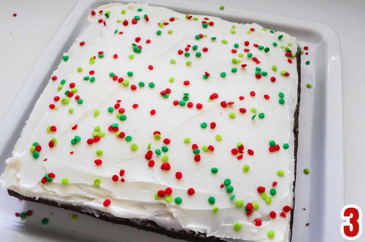 Overhead shot of the Christmas Sprinkles on the frosting of the Homemade Gingerbread Cake.