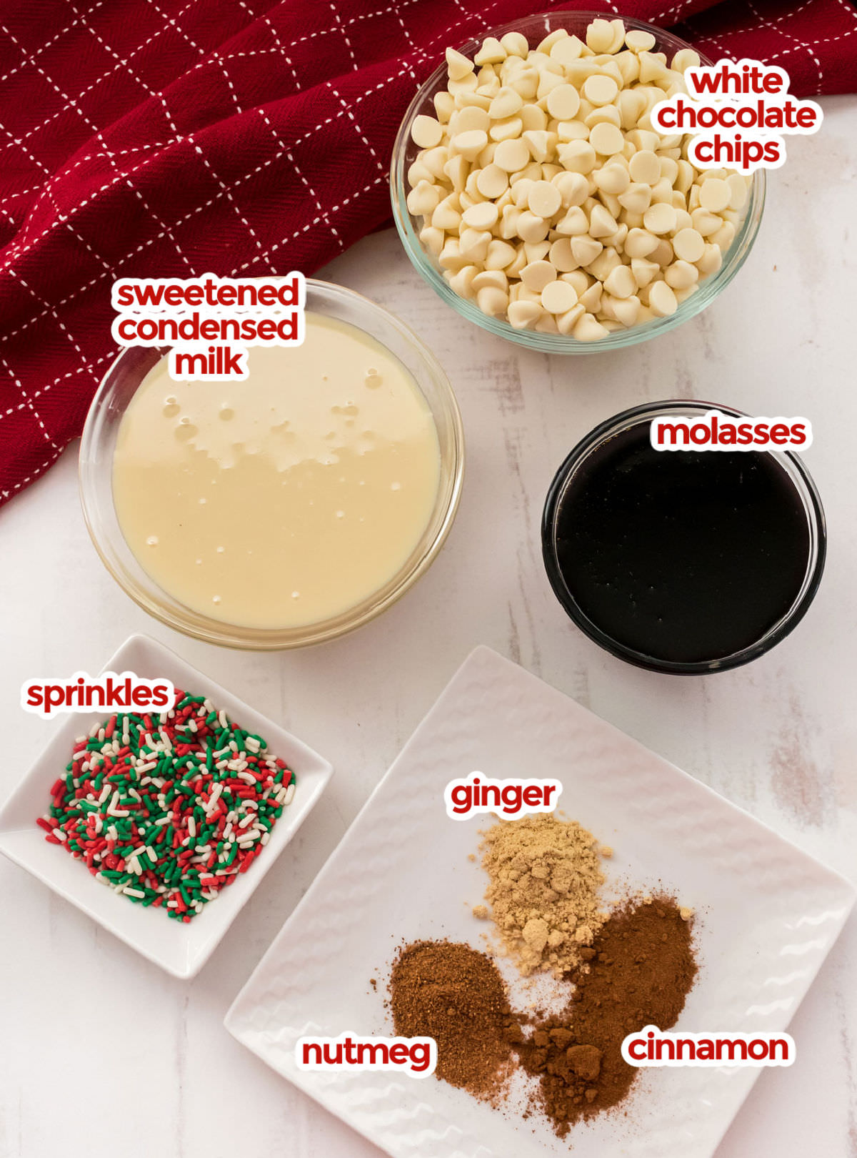 All the ingredients you will need to make Gingerbread Fudge including White Chocolate Chips, Sweetened Condensed Milk, Molasses, Ginger, Nutmeg and Cinnamon. 