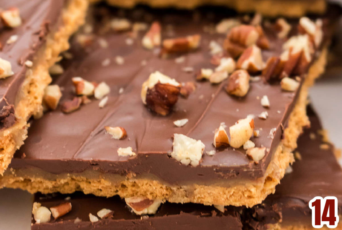 Closeup on the three layers of a piece of Graham Cracker Toffee.