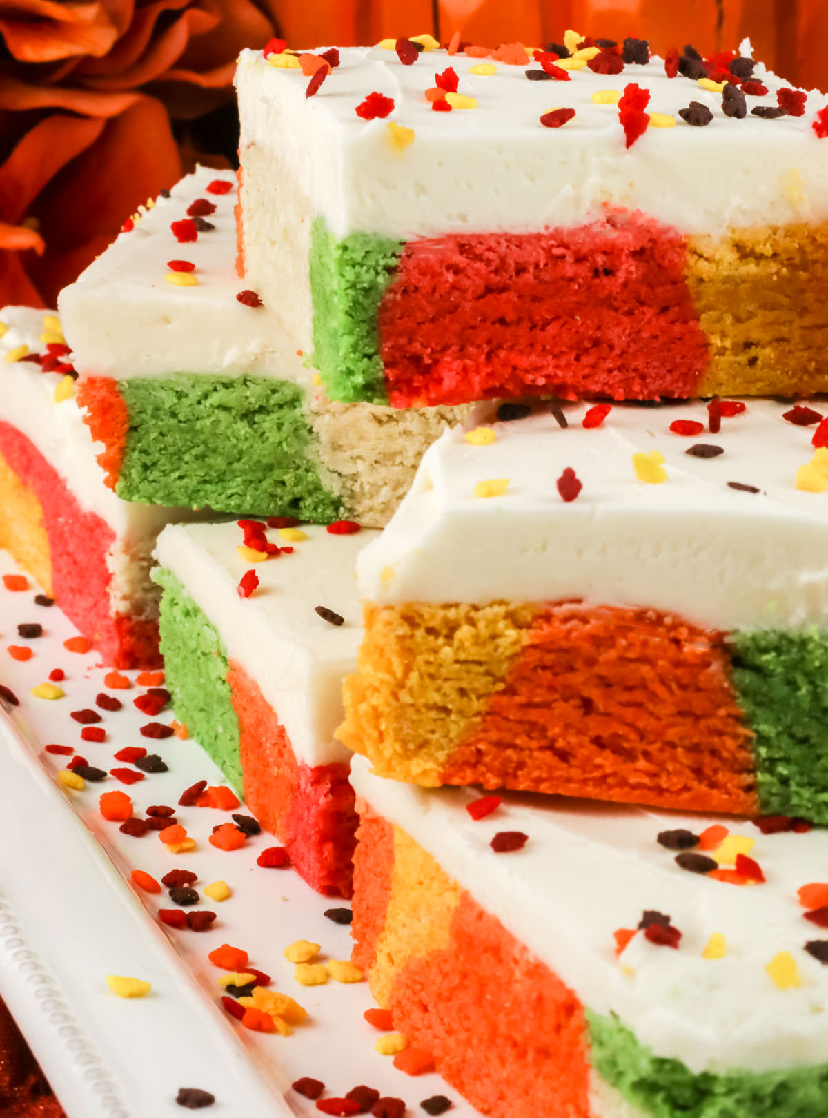 Closeup on a white serving platter filled with Harvest Marble Sugar Cookie Bars and fall sprinkles.