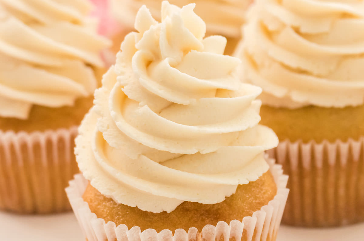 Closeup on a swirl of Buttercream Frosting on a Homemade Vanilla Cupcake.