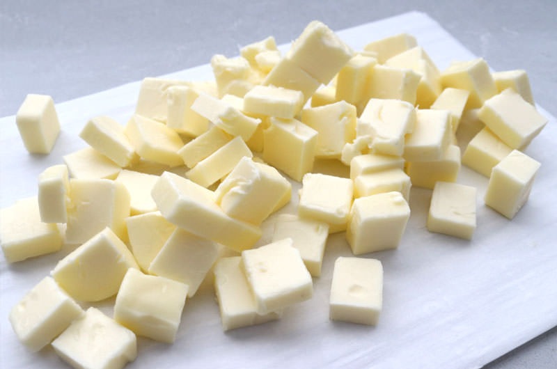 picture of cubed button on a white cutting board