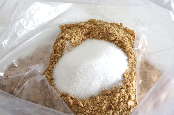 Add sugar to the graham cracker crumbs
