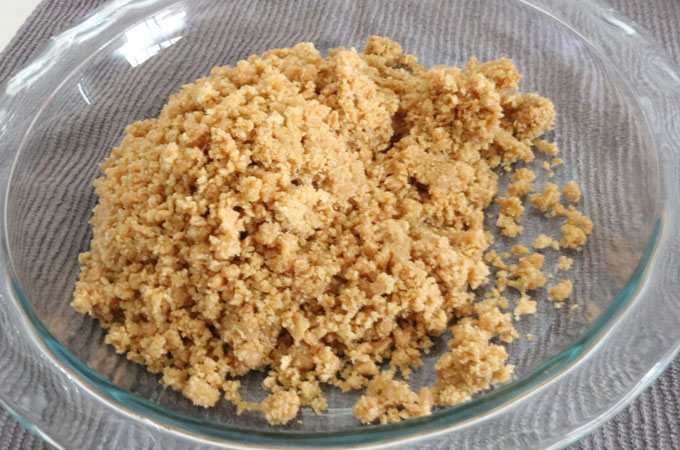 Pour crumbs into pie plate