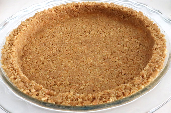 We show you How to Make Graham Cracker Crusts that are super easy to make, can be bake or no-bake and taste better than anything you can buy in the store. This is the Best Graham Cracker Crust recipe that you are going to find. Pin this Perfect Graham Cracker Crust recipe for later and follow us for more pie crust recipe ideas.