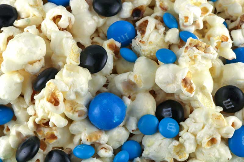 Jacksonville Jaguars Popcorn for those Jacksonville Jaguars fans in your life. Sweet, salty, crunchy and delicious and it is extremely easy to make. This delicious popcorn will be perfect at your next game day football party. a NFL playoff party or a Super Bowl party. Follow us for more fun Super Bowl Food Ideas. #jacksonvillejaguars #jaguars #superbowl #superbowlparty #superbowlfood #jacksonvillejaguarsfood