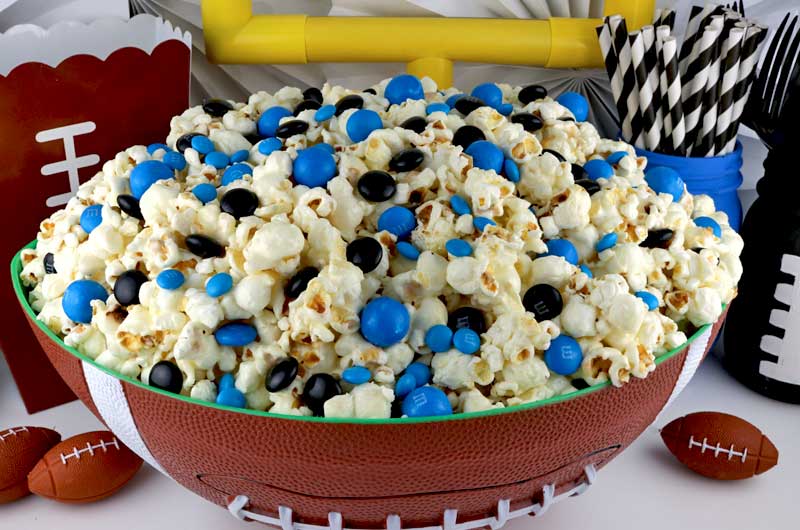 Jacksonville Jaguars Popcorn for those Jacksonville Jaguars fans in your life. Sweet, salty, crunchy and delicious and it is extremely easy to make. This delicious popcorn will be perfect at your next game day football party. a NFL playoff party or a Super Bowl party. Follow us for more fun Super Bowl Food Ideas. #jacksonvillejaguars #jaguars #superbowl #superbowlparty #superbowlfood #jacksonvillejaguarsfood