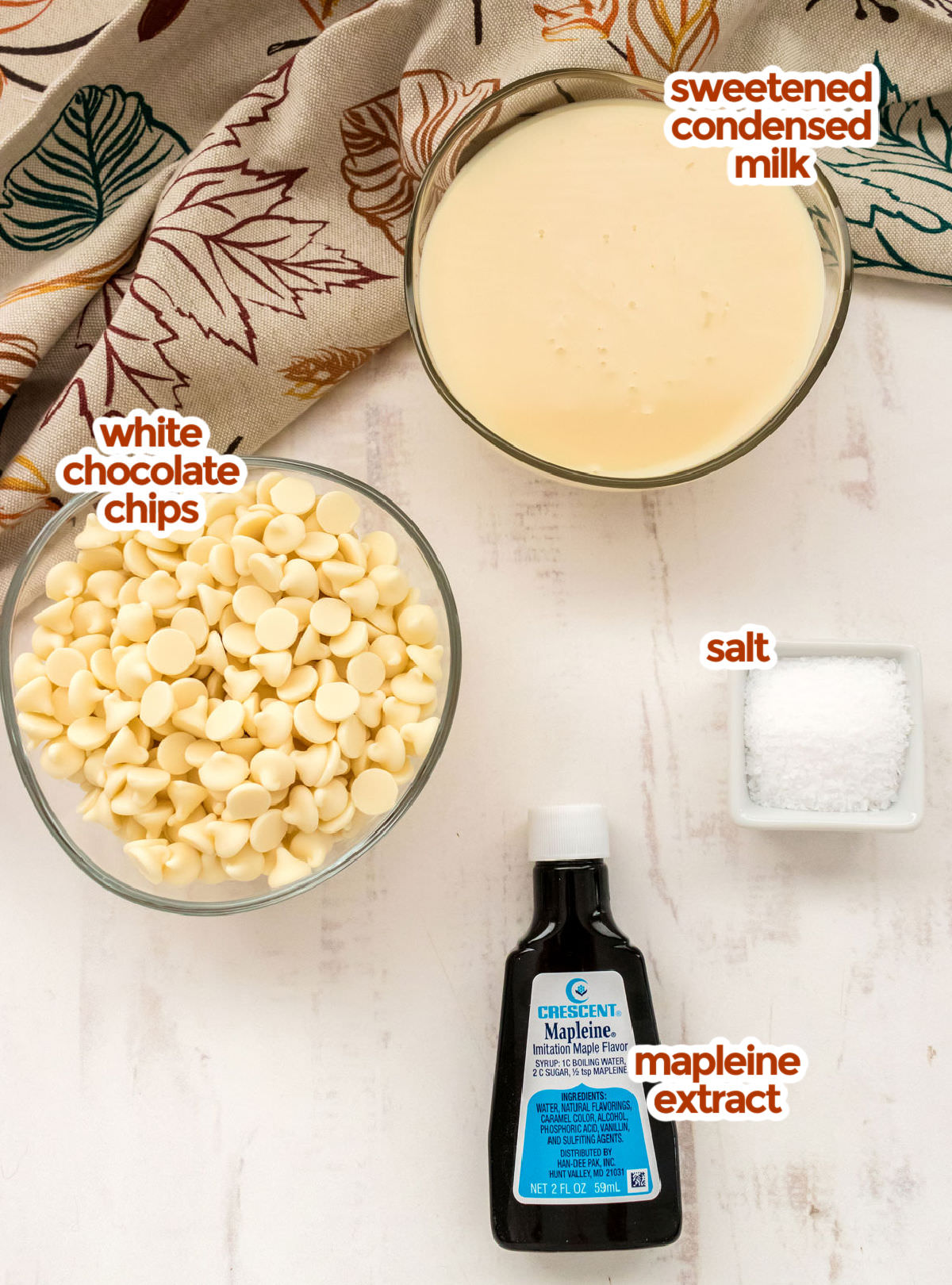All the ingredients you will need to make Maple Fudge including Sweetened Condensed Milk, White Chocolate Chips, Salt and Mapleine Extract.