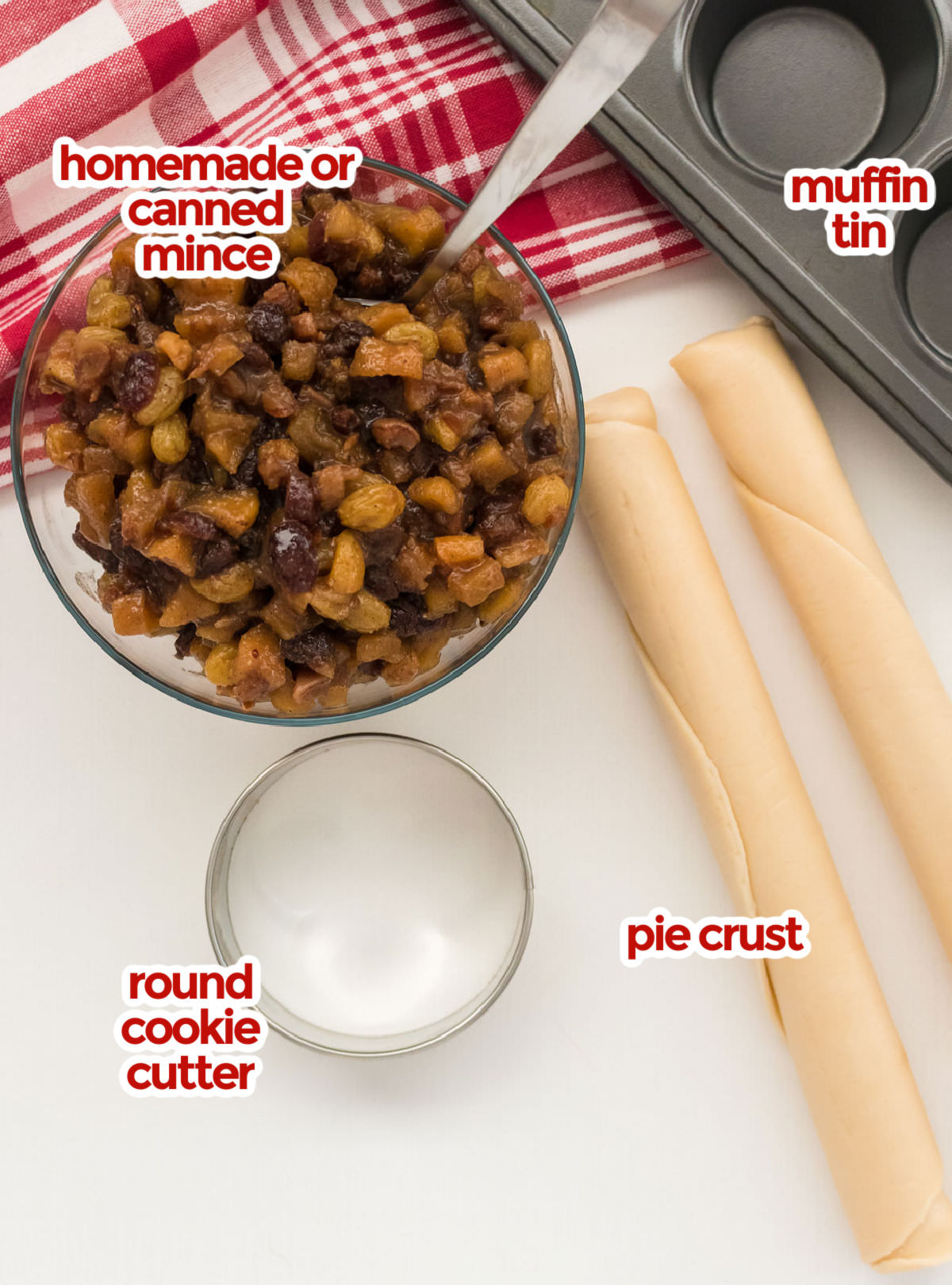 All the ingredients you will need to make Mini Mince Pies including mincemeat, pie crust, muffin tin and a round cookie cutter.