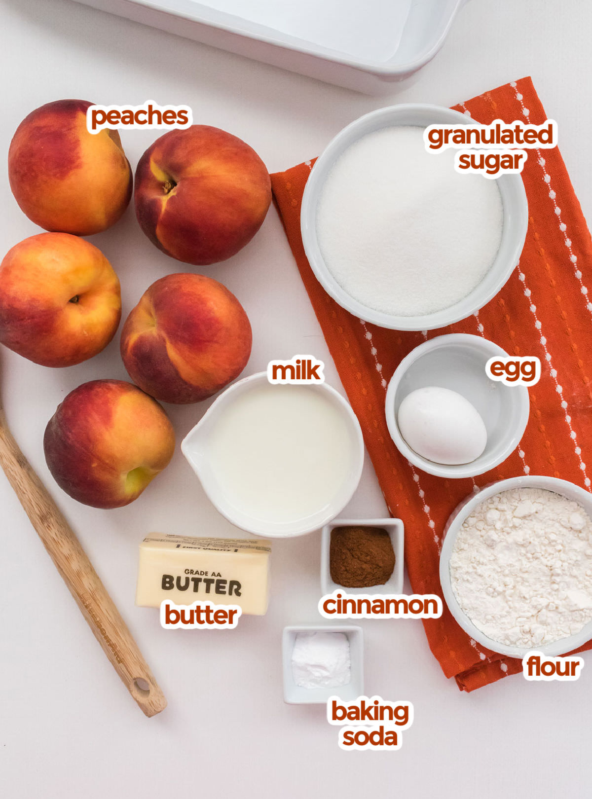 All the ingredients you will need to make Old Fashioned Peach Cobbler including Peaches, Sugar, Egg, Milk, Flour, Cinnamon, Baking Soda and Butter.