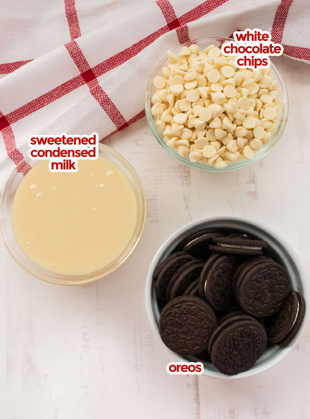 All the ingredients you will need to make Oreo Fudge including White Chocolate Chips, Sweetened Condensed Milk and Oreo Cookies.