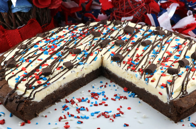 Patriotic Ice Cream Cookie Pizza - a fun and yummy dessert pizza made with chocolate cookie and vanilla ice cream topped with gorgeous red white and blue sprinkles. This Fourth of July dessert will wow the guests at your 4th of July party. Pin this 4th of July treat for later and follow us for more great 4th of July Food ideas. #4thofJuly #fourthofjuly #4thofJulyTreats #4thofJulyDesserts #4thofJulyFoodIdeas