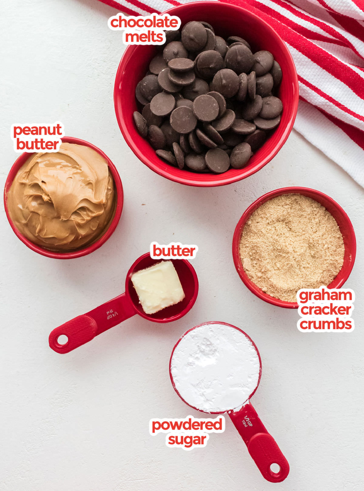 All the ingredients you will need to make Peanut Butter Balls including Peanut Butter, Chocolate, Graham Cracker crumbs, Powdered Sugar and  Butter.