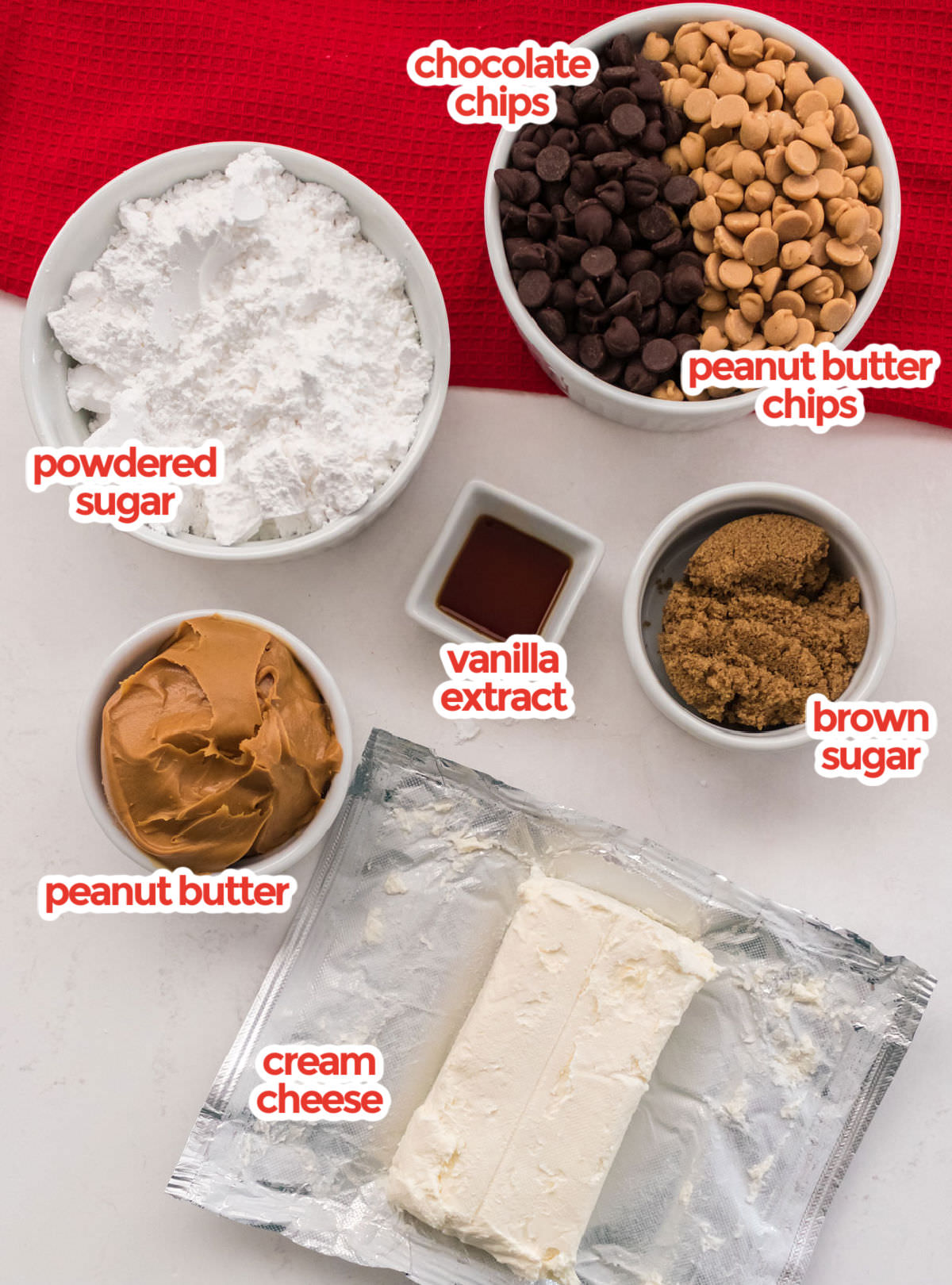 All the ingredients needed to make Peanut Butter Cheese Balls including cream cheese, powdered sugar, peanut butter, vanilla, chocolate chips and peanut butter chips.
