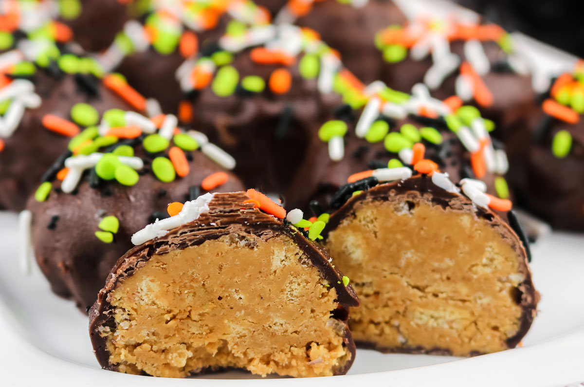 Closeup on the white platter filled with Peanut Butter Crunch Balls.