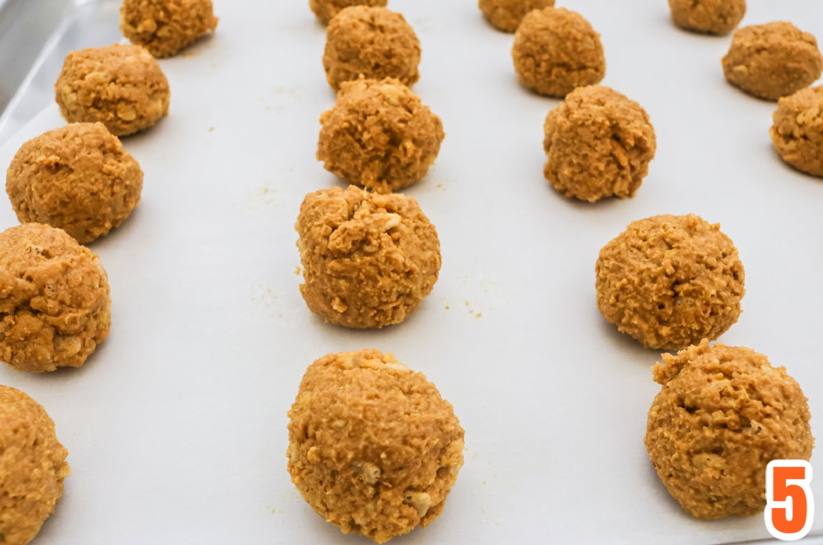 Peanut Butter Crunch Balls on a cookie sheet.