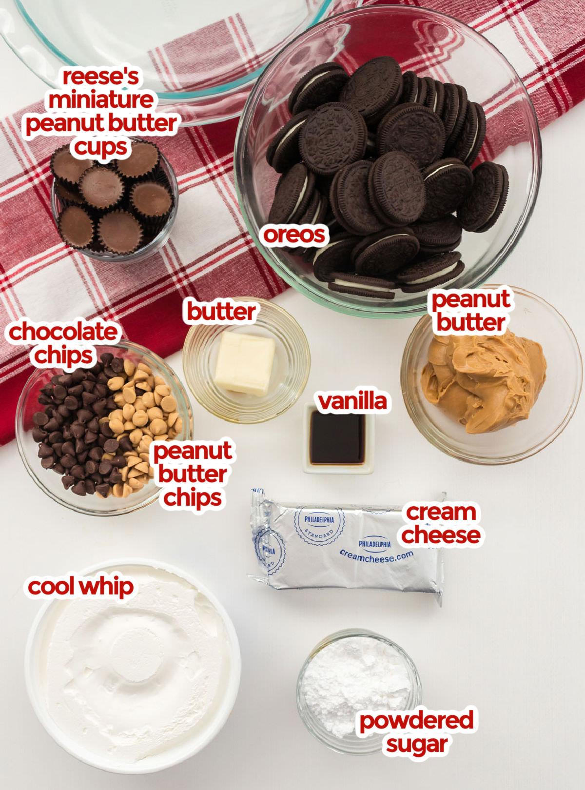 All the ingredients you will need to make Peanut Butter Pie including Oreo Cookies, Peanut Butter Cups, Peanut Butter, Cream Cheese, Cool Whip, Peanut Butter Chips, Chocolate Chips, Vanilla and Powdered Sugar and Butter.