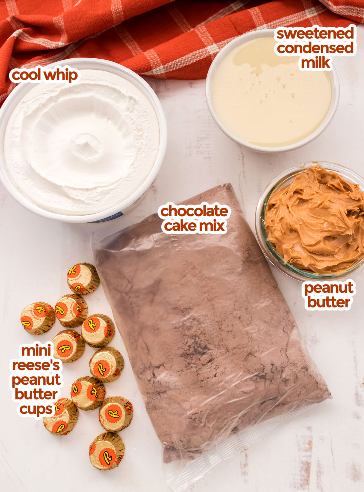 All the ingredients you will need to make Chocolate Peanut Butter Poke Cake including chocolate cake mix, peanut butter, sweetened condensed milk, cool whip and mini Reese's Peanut Butter Cups.