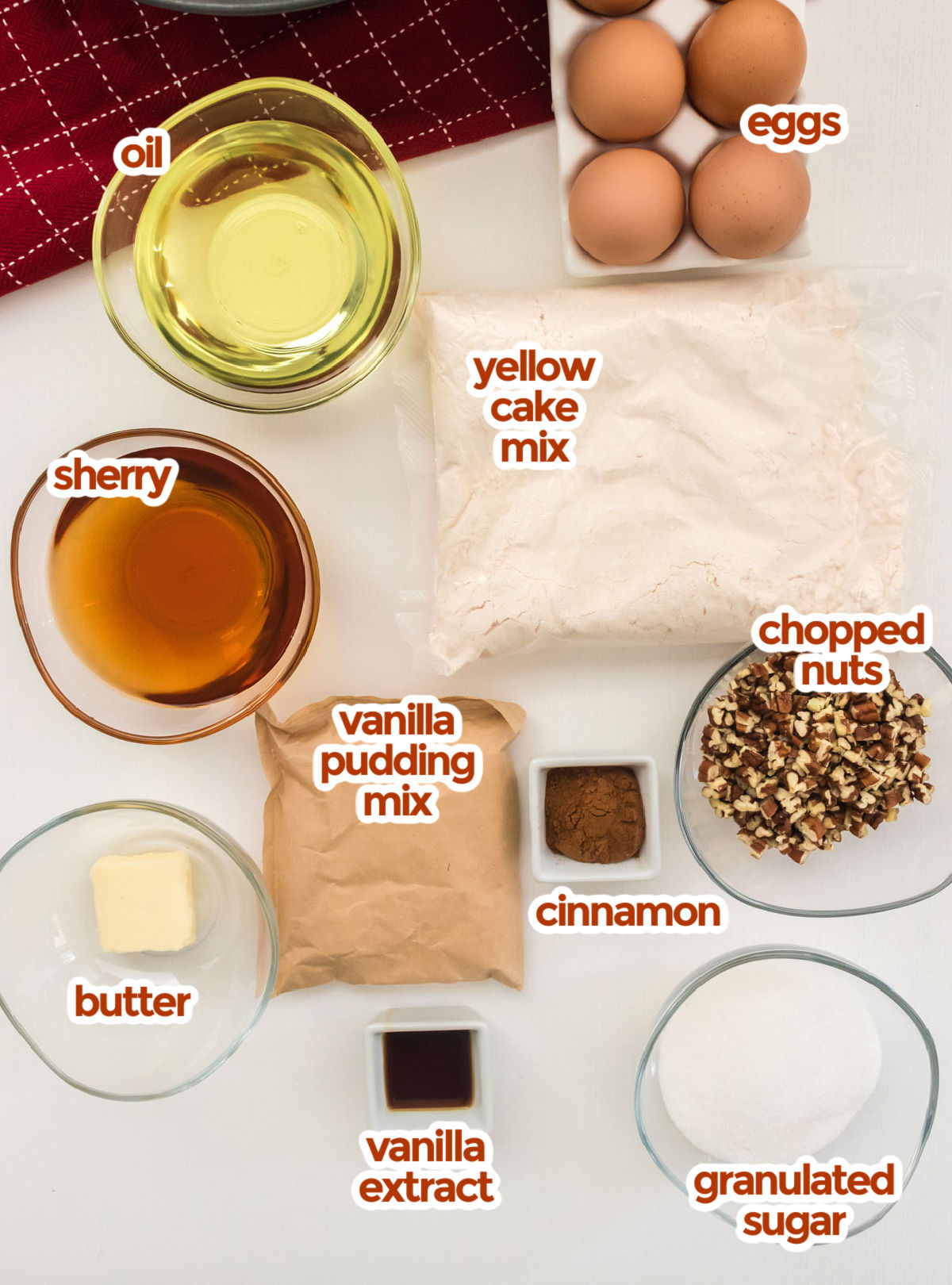 All the ingredients you will need to make Christmas Morning Coffee Cake including yellow cake mix, eggs, oil, sherry, chopped nuts, vanilla pudding mix, cinnamon, butter, vanilla and granulated sugar.