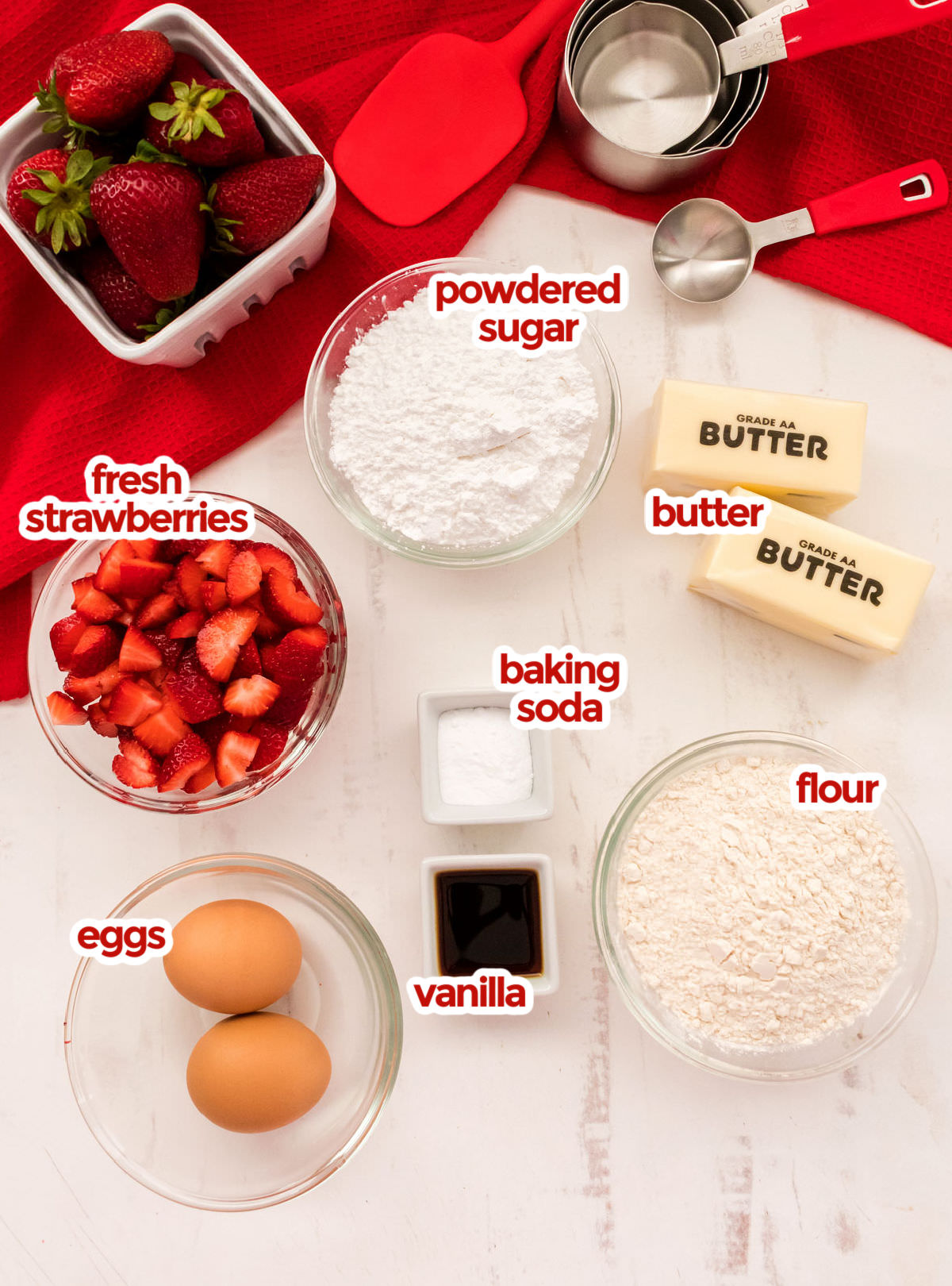 All the ingredients you will need to make Strawberry Shortcake Cookies including butter, powdered sugar, eggs, vanilla, flour, baking soda and fresh strawberries.