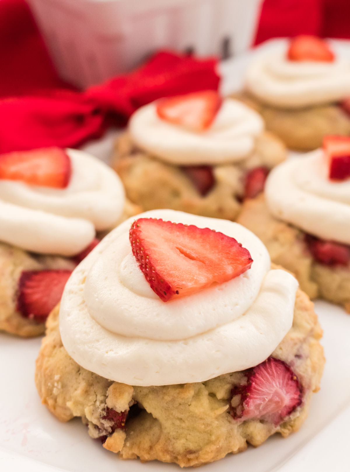 Closeup on a white serving platter filled with Strawberry Shortcake Cookies.